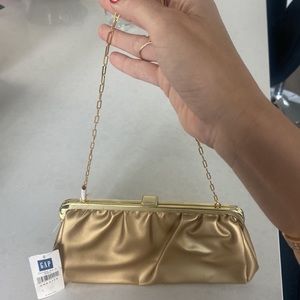 Dainty gold evening purse, NWT but has some imperfections, see photos.